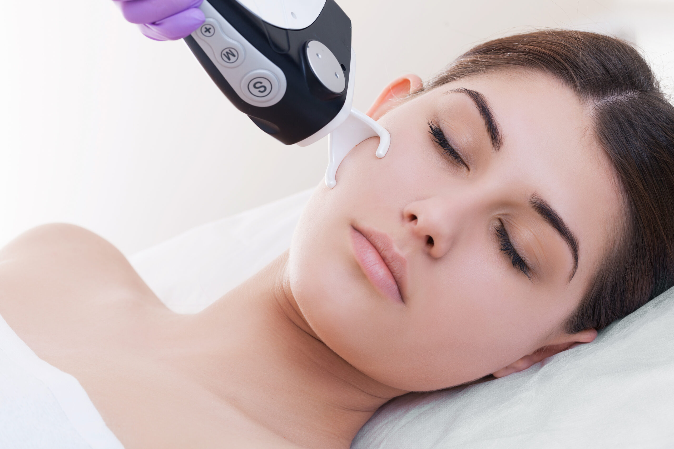 Doctor woman making to patient laser skin resurfacing in aesthet