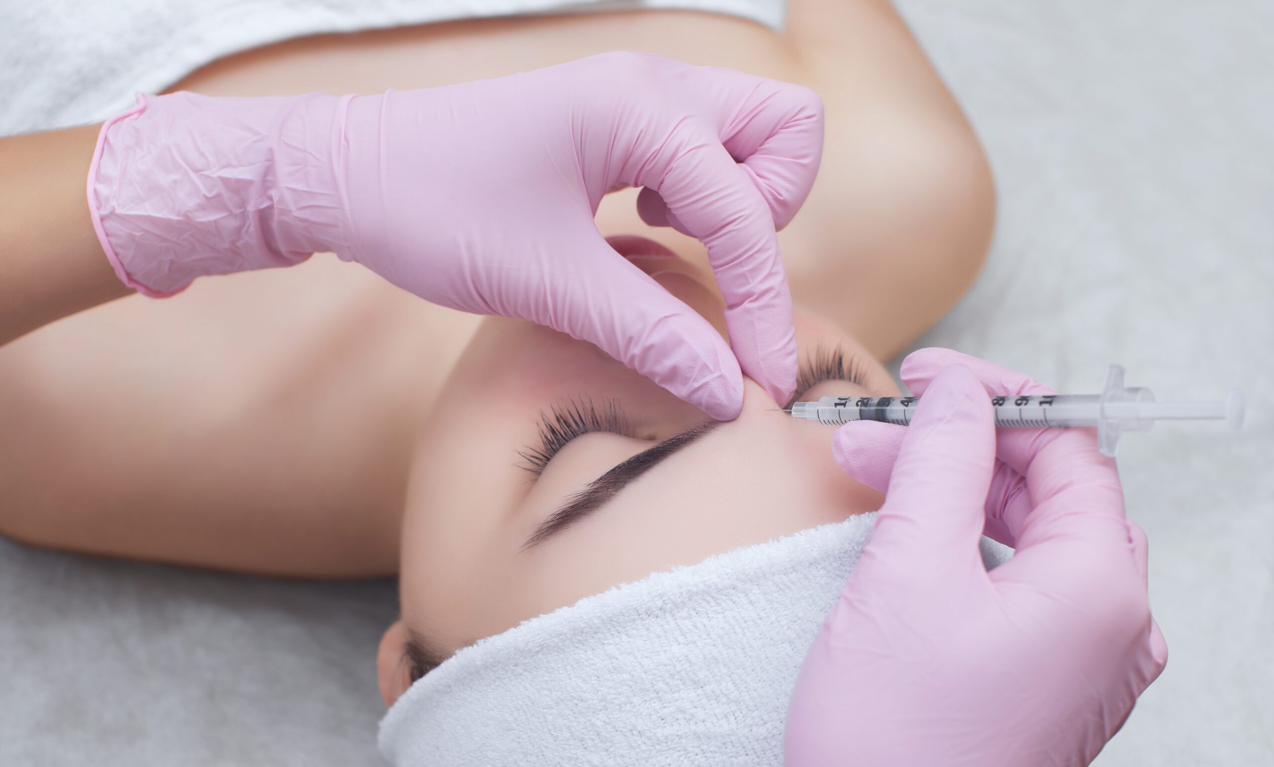 The doctor cosmetologist makes the Rejuvenating facial injection