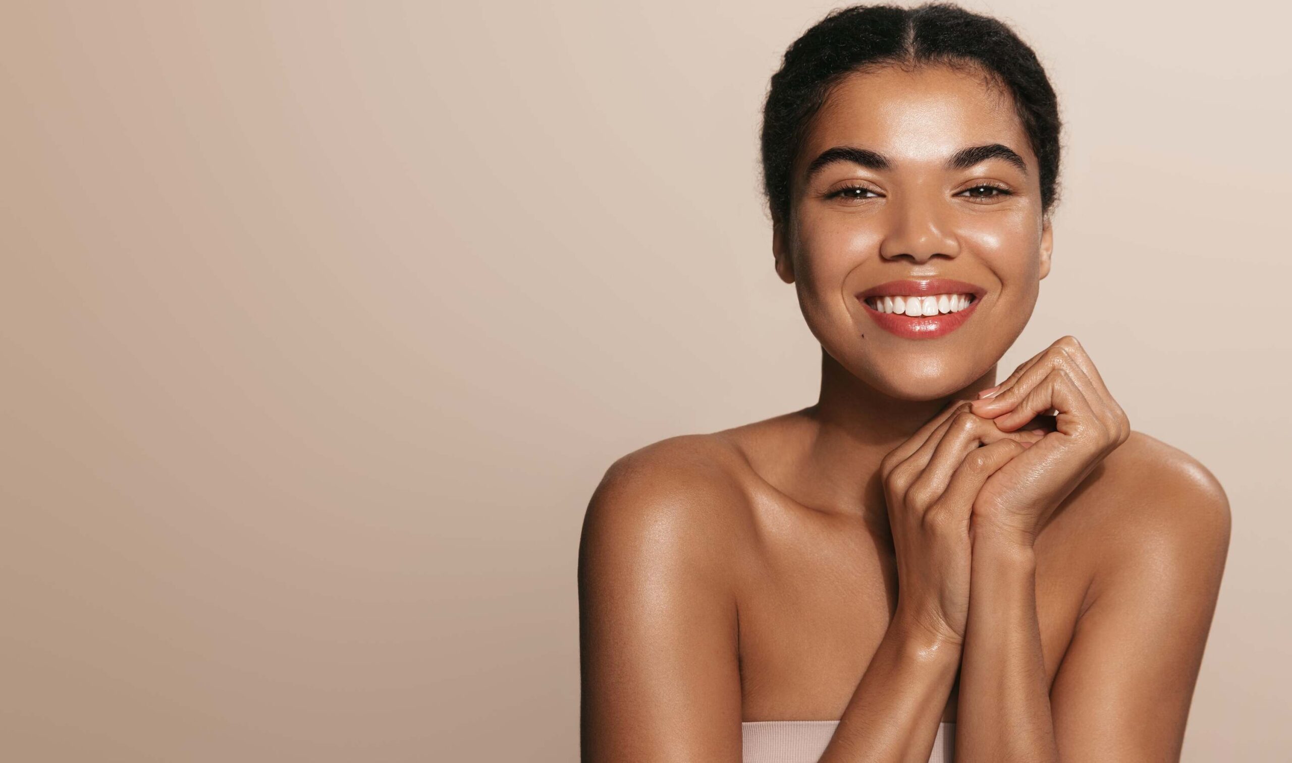 A woman smiling after having a Moxi Treatment.
